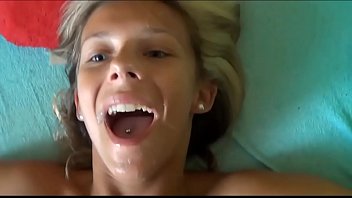 cumshot on pretty face with blue eyes