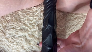 PUSHED A BLACK DILDO INTO A HUGE WHITE PUSSY, MOANING REQUESTS A COCK